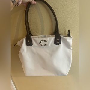 Wonder C white leather handle shoulder purse. Navy book bag